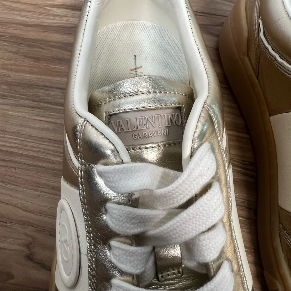 Valentino Garavani Women’s Upvillage Trainer Sneakers in Laminated Calfskin Gold